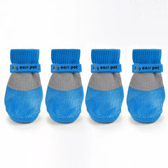 Waterproof, anti-slip dog socks with silicone soles for paw protection and grip on slippery surfaces.