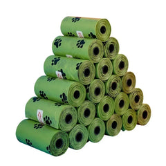 Biodegradable, scented pet waste bags with tie handles for easy and eco-friendly disposal.