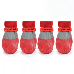 Waterproof, anti-slip dog socks with silicone soles for paw protection and grip on slippery surfaces.